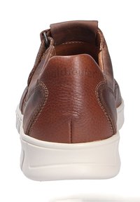 Brown leather slip-on sneaker with textured surface, white rubber sole, and padded collar. Features minimal stitching and a clean design.