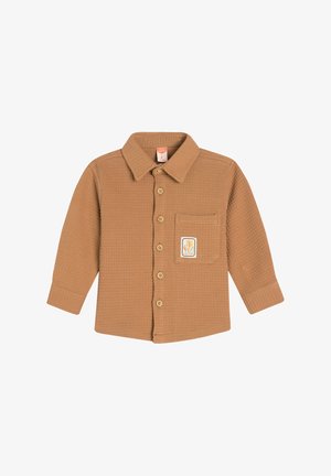 Ruskea teksturoitu pitkähihaisen vauvan paita, jossa on kaulus, nappi etuosa, rintatasku ja tarranauha, jossa on oranssi kasvien kuvio, jonka nimi on "luonto".