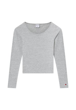 Grijs cropped shirt met lange mouwen, gemaakt van zachte stof met een ronde halslijn, voorzien van een klein logo op de rechtermouw.