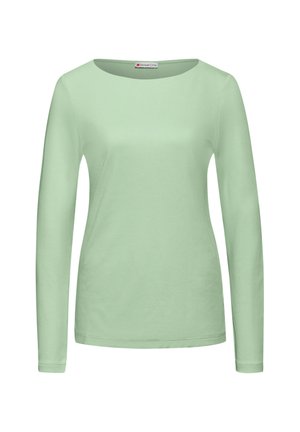 Haut à manches longues vert clair en tissu doux et lisse ; présente un col rond et une coupe slim sans motifs ni embellissements.