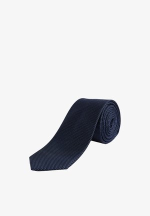 Granatowy krawat z textured materiału, z wzorem małych niebieskich kropek, starannie zwinięty z ostrym końcem.