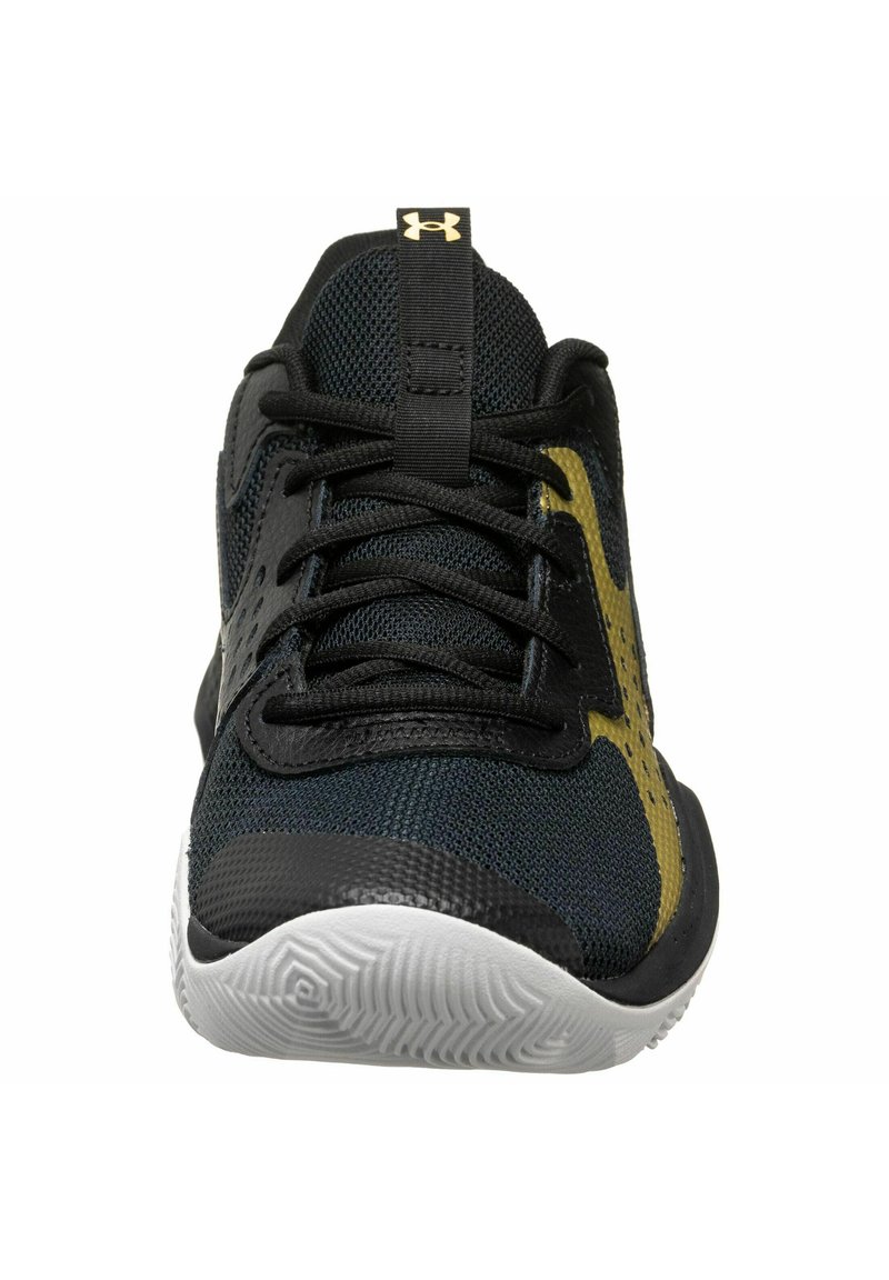 Baskets de sport noires et dorées avec une tige en mesh, des lacets plats et une semelle texturée. Comprend un logo bien en vue sur la languette.