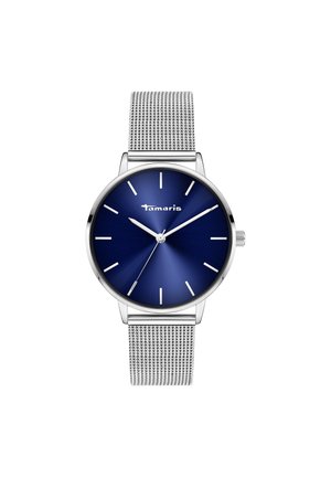 Montre argentée ronde avec un cadran dégradé bleu, des index d'heure argentés et un bracelet en maille en acier inoxydable. Nom de la marque "Tamaris" affiché.