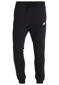 Pantaloni della tuta neri in misto cotone, con vita elasticizzata e cordoncino, polsini alle caviglie e logo Nike bianco sulla parte anteriore.
