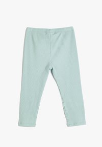 Leggings acanalados de un suave verde menta con una cintura elástica y un ajuste ceñido, que presentan una superficie texturizada y detalles de costura suave.