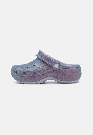 Glittery purple clog made of lightweight material, featuring ventilation holes, a raised heel, and a grey rubber sole.