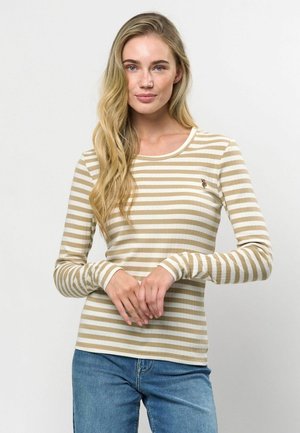 Beige és fehér csíkos, hosszú ujjú ing bordás textúrával, kerek nyakkivágással és apró hímzett mintával a mellen.