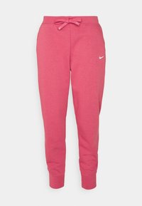 Rosa Jogginghose aus weichem Material, mit einem elastischen Bund und Kordelzug sowie einem kleinen weißen Nike-Logo am linken Bein.