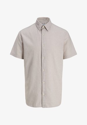 Rövid ujjú, bézs színű, elől hét gombbal záródó ing, hegyes gallérral, könnyű anyagból készült.