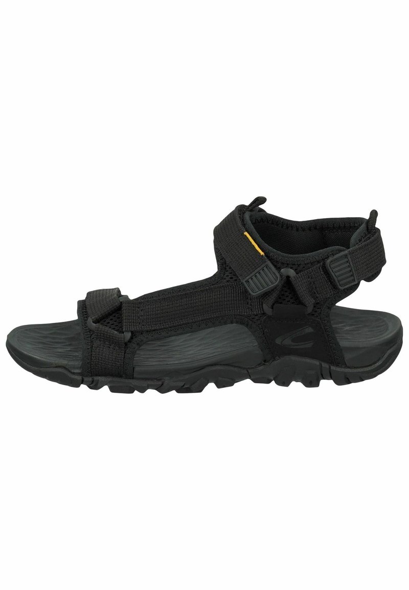 Black outdoor sandals with adjustable straps, textured rubber sole, and padded ankle support. Features plastic buckles and reinforced stitching.