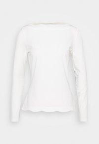 White long-sleeve shirt with scalloped hem and boat neckline, displayed on a plain background.