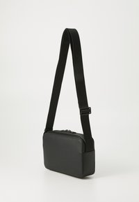 Tommy Hilfiger MONOGRAM REPORTER UNISEX - Schoudertas - black