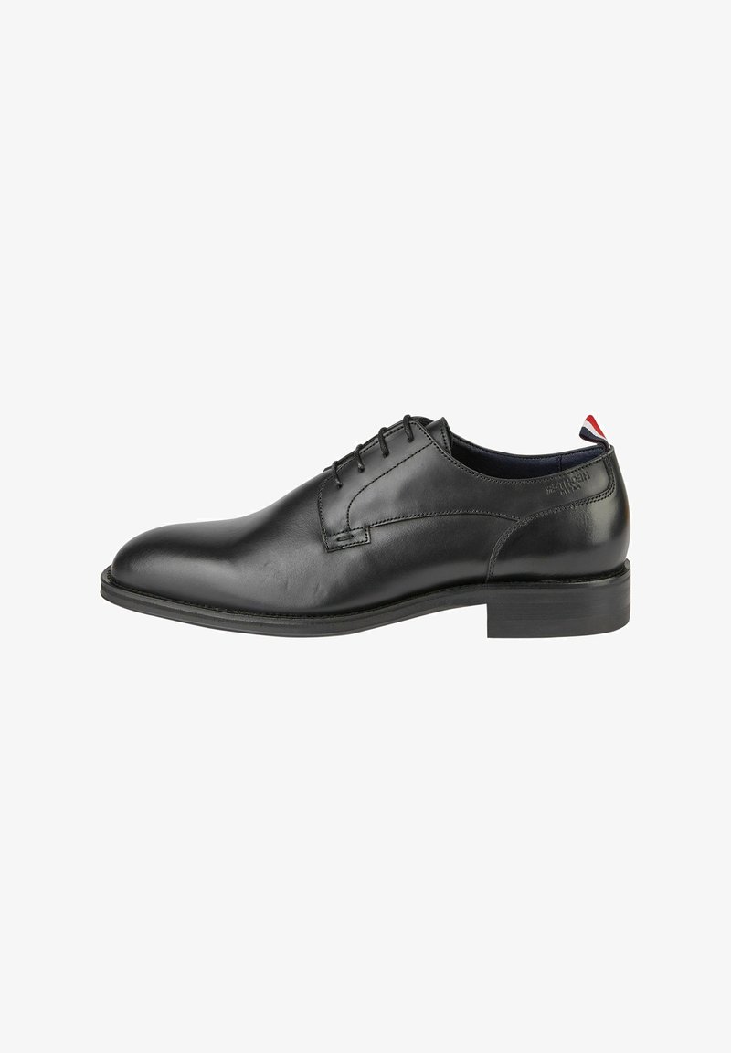 Zwarte leren kleding schoen met een gladde afwerking, elegante afgeronde punt, vijf veterogen en een minimalistisch ontwerp. Rubberen zool met een lage hak.