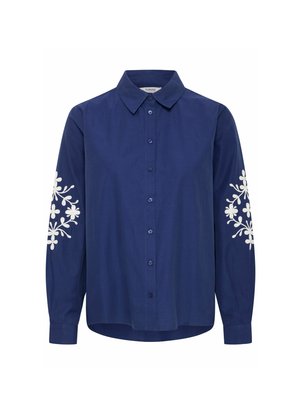 Navyblauw overhemd met knopen van katoen met lange mouwen, voorzien van witte bloemenborduursels op de schouders en een klassieke kraag.