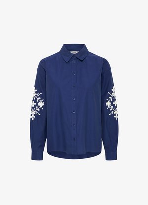Navyblauw overhemd met knopen van katoen met lange mouwen, voorzien van witte bloemenborduursels op de schouders en een klassieke kraag.