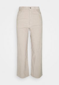 Beige corduroy broek met een hoge taille, recht model, voorzakken en een metalen knoopsluiting. Heeft een gestructureerd verticaal ribbelpatroon.
