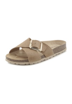Beige Wildleder-Slidesandale mit gekreuzten Riemen und großer rechteckiger Metallschnalle auf konturierter Korksohle.