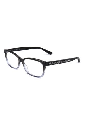 Occhiali rettangolari neri con lenti trasparenti e dettagli decorativi di glitter argento sulle aste, inclinati su sfondo bianco.