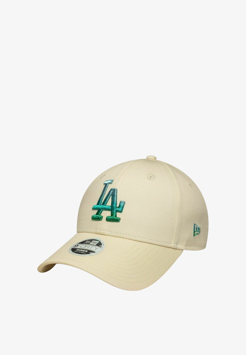 Khaki baseball cap featuring green embroidered "LA" logo. Smooth fabric, curved visor, and black sweatband with tag detailing.