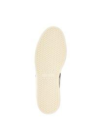 Suela de zapatilla de goma blanca con un patrón de agarre texturizado, con el logo "TOMMY JEANS" en el centro y un borde de color beige claro.