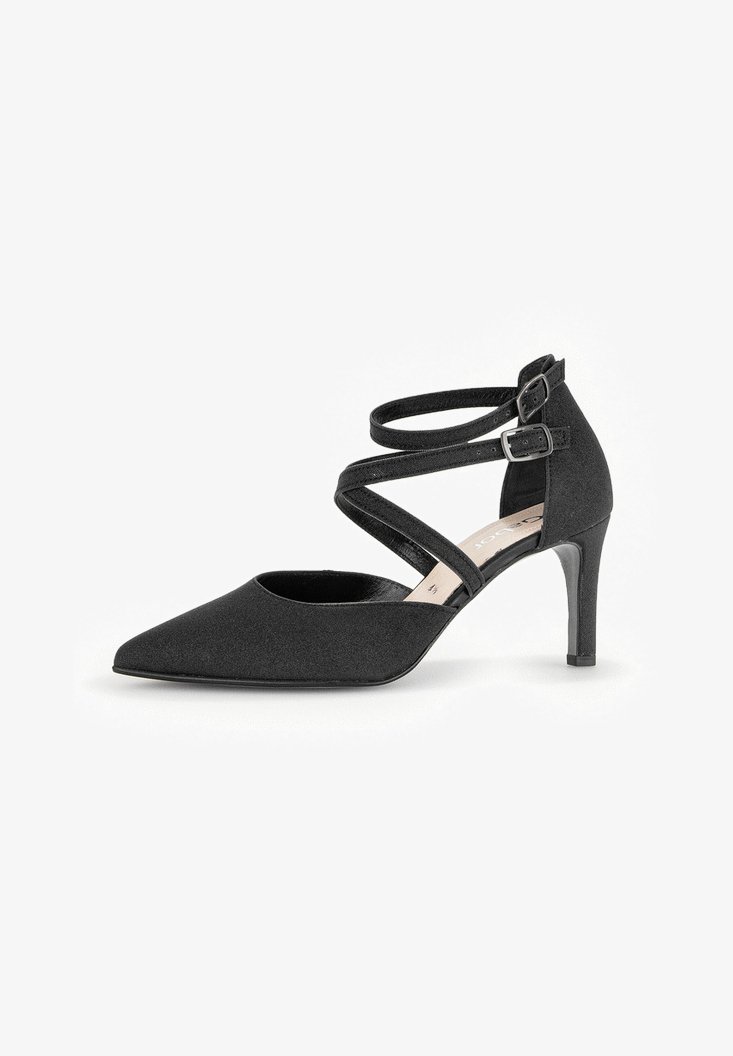 Schwarzer High-Heel-Schuh mit spitzem Fuß, versehen mit überkreuzten Knöchelriemen und einem schlanken Absatz. Die Oberfläche wirkt glatt und strukturiert.