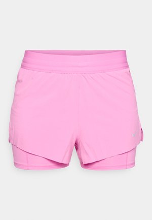 Pink layered athletic shorts with inner compression lining, elastic waistband, and small grey Nike logo on the right side.