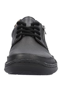 Black leather shoe featuring a rounded toe, lace-up front, and side zipper. Textured surface with visible stitching and a rubber sole.