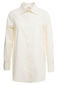 Cremfarbendes Langarmshirt mit vertikalen Nadelstreifen, Knopfleiste und klaren Kragen; aus einem leichten Stoff gefertigt.