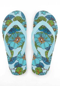 Blue floral flip-flops with a patterned footbed featuring green leaves and orange flower centers. Soft rubber straps in light blue.