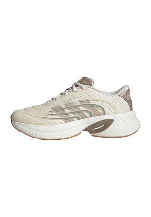 Scarpa da ginnastica beige chiaro con tomaia strutturata, dettagli argento e suola ammortizzata. Presenta una punta arrotondata e un tallone traforato per la traspirabilità.