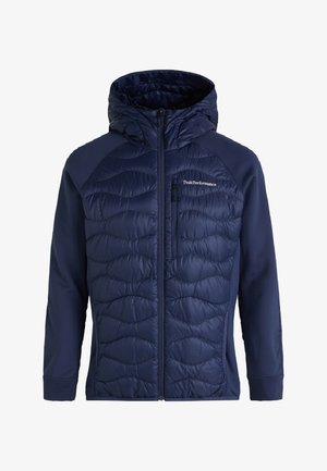 Marineblaue Jacke mit einem gesteppten Vorderteil, glatten Ärmeln und Kapuze. Verfügt über einen Reißverschluss und ein Logo auf der oberen linken Brust.