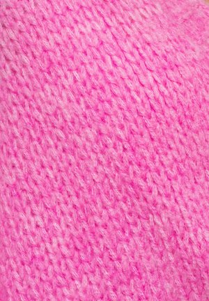 Ljust rosa stickat tyg med en mjuk, texturerad yta, med synliga stygn och en något varierad nyans genom hela.