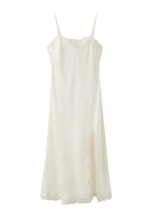 Robe longue blanche sans manches avec fines bretelles et bords festonnés, avec une fente latérale.