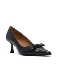 Black leather pump with a pointed toe and a small bow accent on the vamp. Features a tapered mid-heel and a smooth, polished texture.