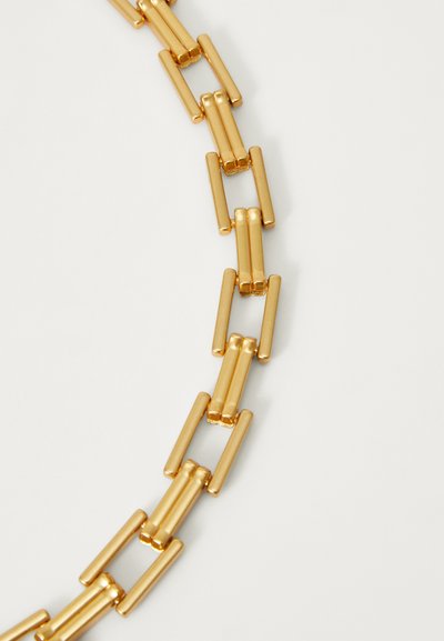 Gold-tone metal necklace featuring elongated rectangular links with a smooth, polished finish, arranged in an alternating pattern.