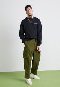 Manastash FLEX CLIMBER - Kargopüksid - oliv