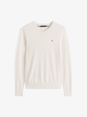 Krém színű V nyakú pulóver puha anyagból. Hosszú ujjú, bordázott mandzsettával és aljjal, valamint egy kis logóval a mellkasán. Egyszerű és klasszikus dizájn.