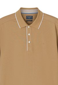 Men’s beige polo shirt with white trim on collar and button placket, featuring three buttons and small embroidered logo on chest.