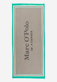 Gewebte Decke in Beige mit schwarzem Hahnentrittmuster, umrandet von grünen und weißen Streifen, mit dem prominent angezeigten "Marc O'Polo" Logo.