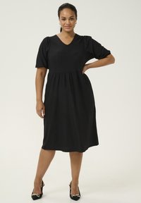 Zwarte jurk tot de knie van textuurstof met een V-hals en korte puffmouwen, met een ingezette taille en zijzakken.