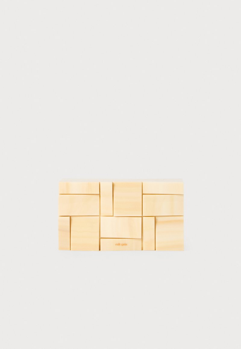 Wooden block set in light natural wood. Rectangular shape with interlocking pieces of various sizes. Smooth surface, minimal design, subtle branding.