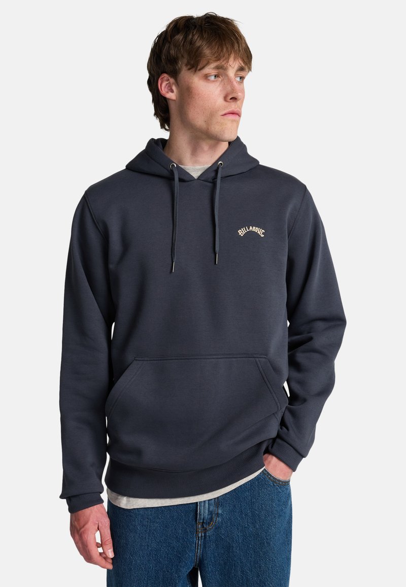 Dark grey hoodie with a front pocket, adjustable drawstrings, and subtle logo embroidered in tan. Soft, smooth texture, standard fit.