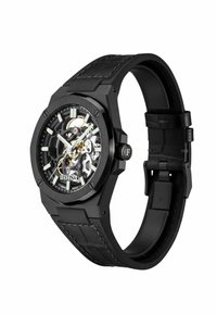 Schwarze Festina-Armbanduhr mit skelettiertem Zifferblatt, das mechanische Zahnräder zeigt, leuchtenden Zeigern, Stundenmarkierungen und schwarzem Lederarmband mit Naht.