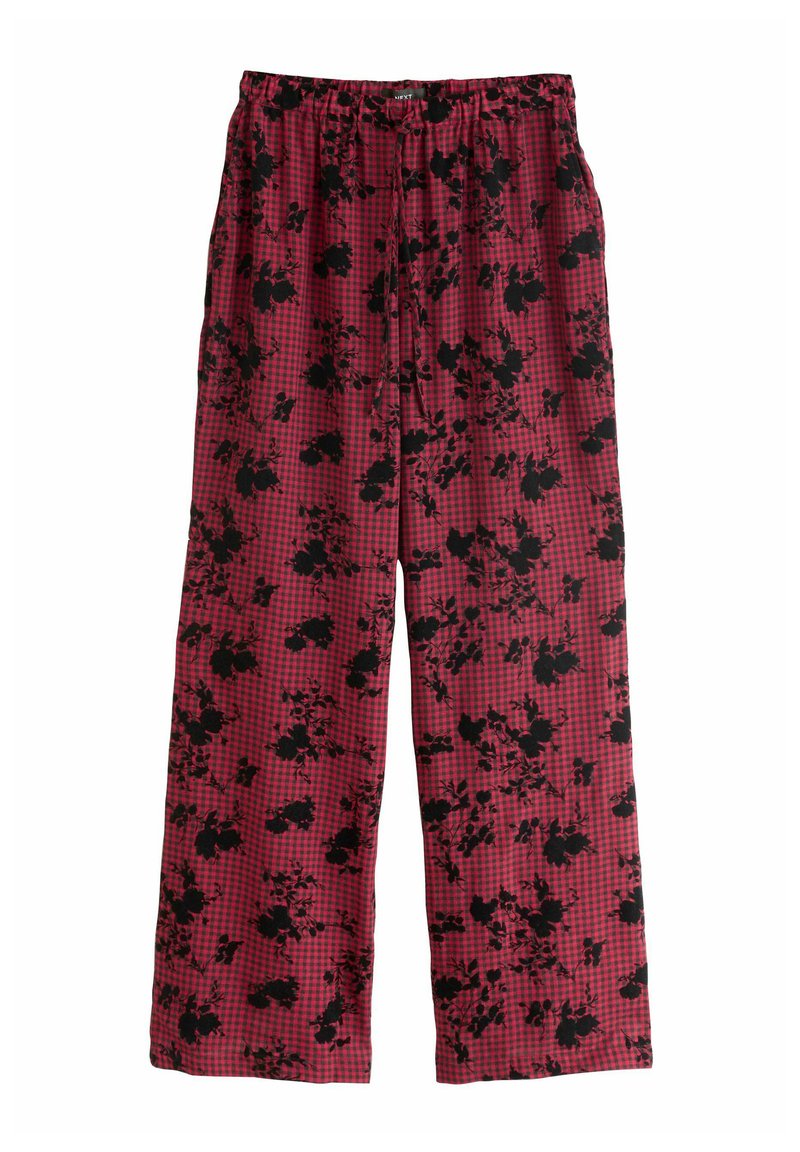 Pantalons large à carreaux rouges et noirs avec un motif floral, dotés d'une taille élastique pour plus de confort et d'une texture de tissu douce.