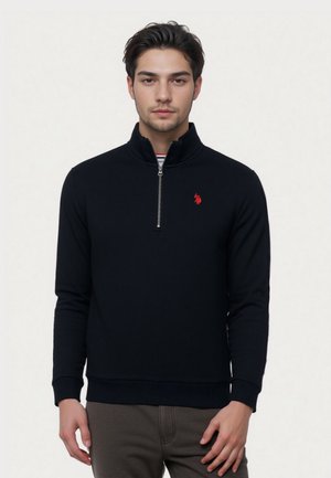 Black zip-up sweatshirt with a stand collar, red logo on the chest, ribbed cuffs and hem, made from a textured, breathable fabric.