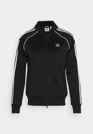 Sort Adidas lynlåstrøje med hvide striber på ærmerne og lille Adidas-logo på venstre bryst, ribbet manchetter og kant.