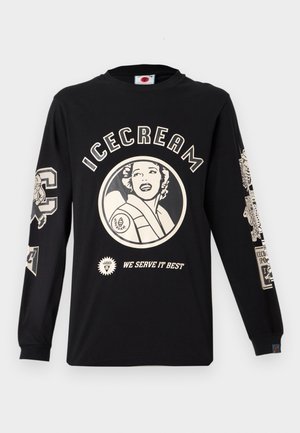 Čierne bavlnené tričko s dlhým rukávom s potlačenou krémovou grafikou, ktorá obsahuje nápis "ICECREAM" a kruhový dizajn so ženskou tvárou.
