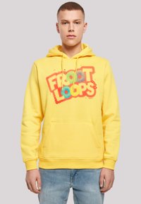 Yellow hoodie with a large, colorful "Froot Loops" graphic on the front. Features a kangaroo pocket and ribbed cuffs. Soft fabric texture.