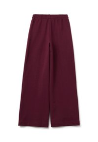 Burgunderfarbene weite Hosen aus weicher Baumwolle, mit einem elastischen Bund und einer glatten Textur ohne sichtbare Muster oder Akzente.