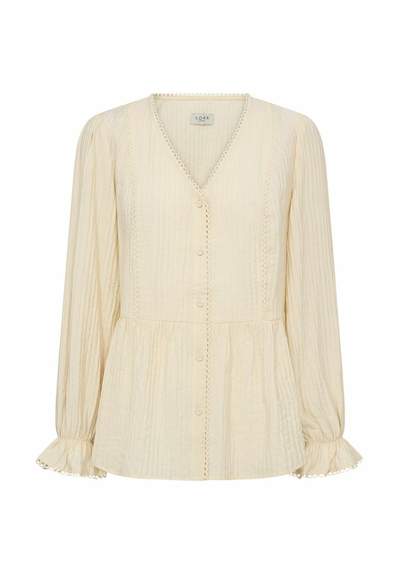 Blusa crema con maniche lunghe, scollo a v e bottoni frontali. Tessuto testurizzato con bordo in pizzo lungo i lati e dettaglio in vita arricciato.